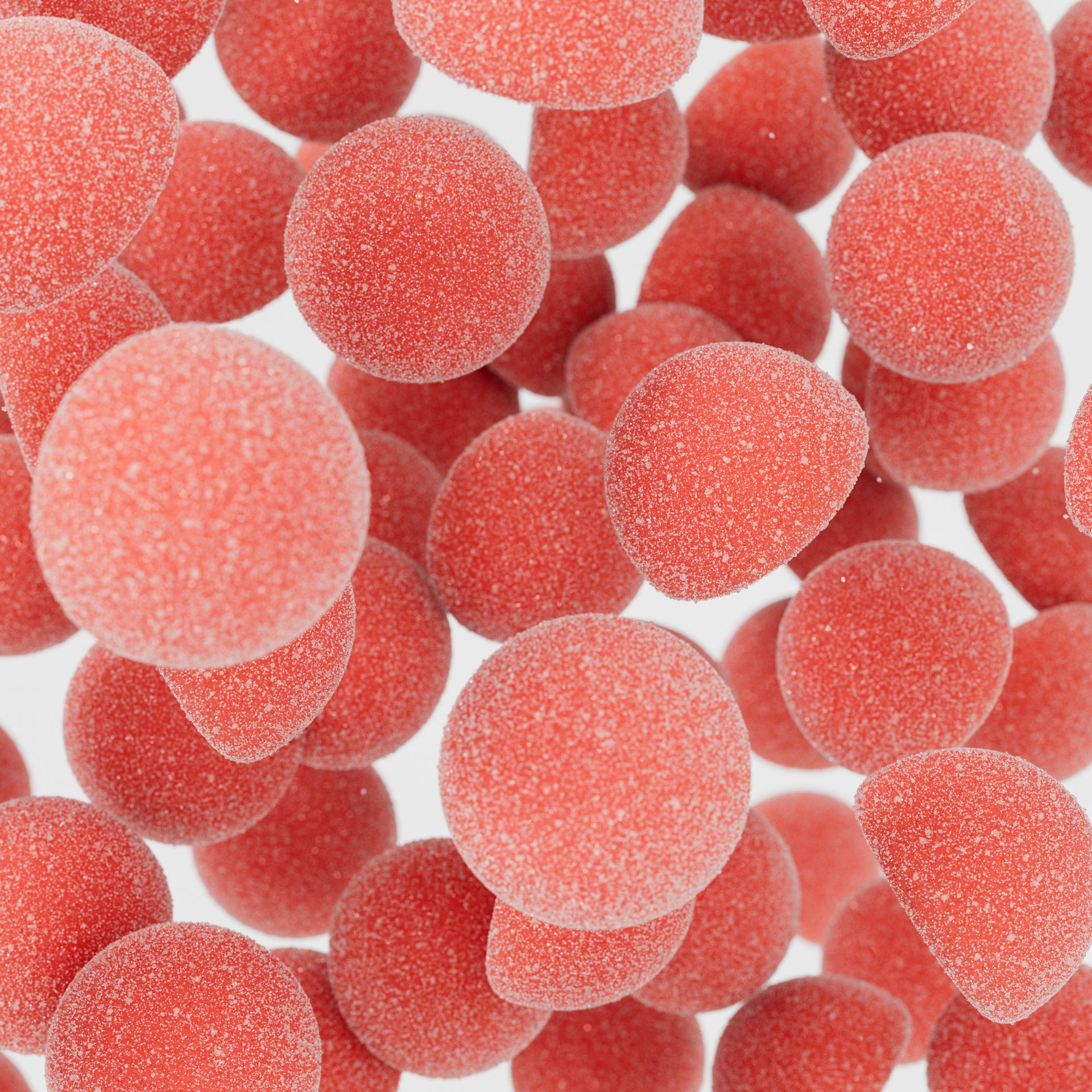 Close-up of red gummy candies on a white background